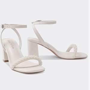 White heels with pearl straps